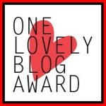 One Lovely Blog Award logo red heart behind words One Lovely Blog Award