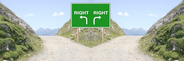 A fork in a mountain with a sign that has arrows pointing in both directions, both of them labeled "right"