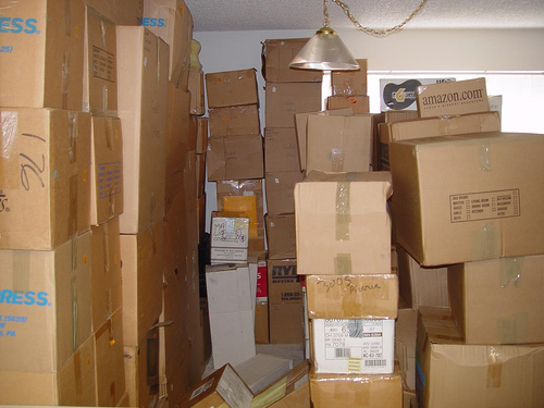 Stacked moving boxes filling most of a room