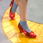 Closeup of Dorothy's ruby slippers as she starts on the yellow brick road in The Wizard of Oz