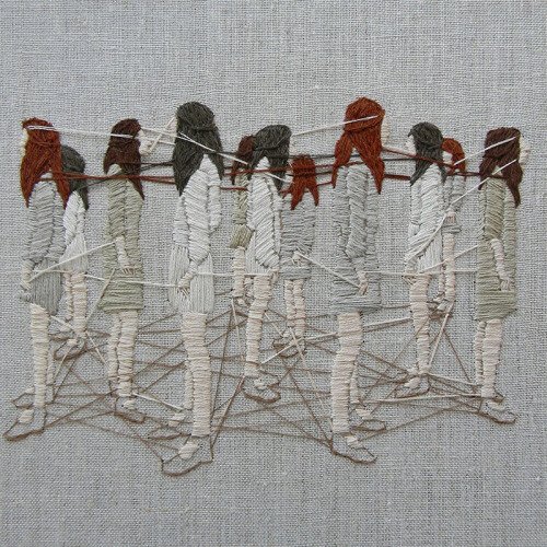 An embroidered picture of several women facing away from each other, but with threads connecting them at the feet, hands and heads.