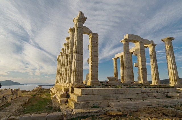 The ruins of a Greek temple, crumbling pilars wiht no roof